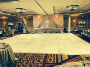 White dance floor and head table draping